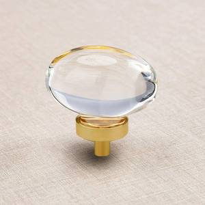 lot 894 image: CLCTK 16 Pack Glass Cabinet Knobs and Pulls, Oval Crystal Knobs for Dresser Drawers, Satin BrassGold Kitchen Cabinet Knobs Egg Shape - Retail $58