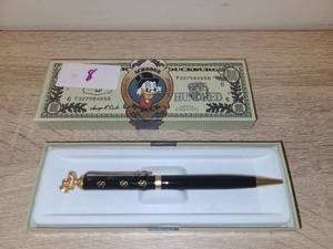 lot 8 image: Scrooge McDuck Ballpoint Pen with $100 Bill Novelty Box