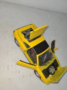 lot 99 image: Die-Cast Yellow Sports Car Model with Opening Parts