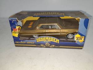 lot 124 image: Lowrider Magazine 1963 Chevy Impala Die-Cast Model with Adjustable Axle