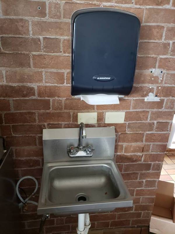 lot 3023 image: Stainless hand sink and paper towel dispenser