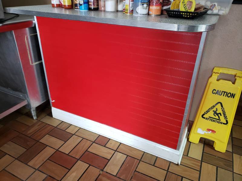 lot 3056 image: This is the other end of the counter previously listed on prior lot.  If you want rounded edges on both ends, buy both, but this can stand alone like the other.  Red in color, nice top