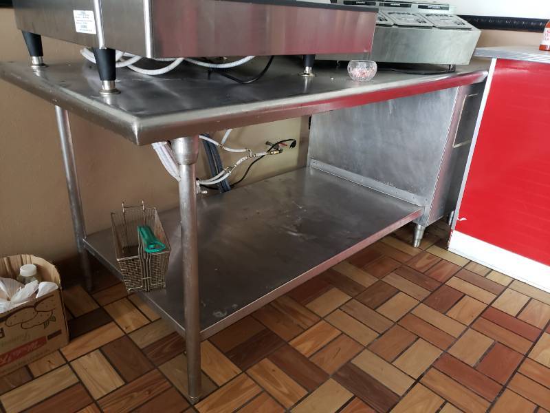 lot 3058 image: Stainless steel table, currently holds Coke dispenser (not included)  Heavy duty