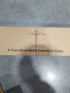 lot 1131 image: 9 Faux Wood Market Umbrella with Pulley