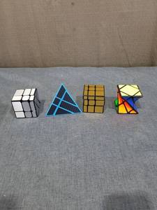 lot 1243 image: Lot of 4 Puzzle Cubes 3x3 Pyraminx Triangle