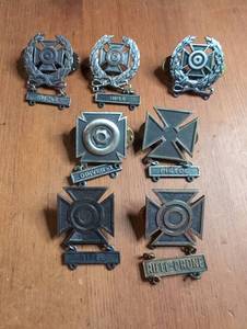 lot 1203 image: Military Marksmanship Qualification Badges 7-Piece Lot RIFLE PISTOL DRIVER