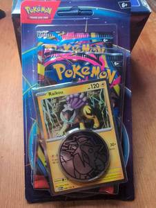Pokémon Trading Card Game Raikou Blister Pack with Metallic Coin and Booster Packs - Sealed