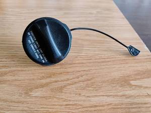 lot 1504 image: Automotive Fuel Tank Cap with Tether �� Click-to-Close