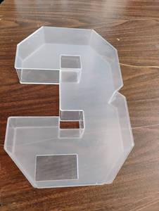 lot 1535 image: Clear Plastic #3 that can be filled with memorabilia or flowers.