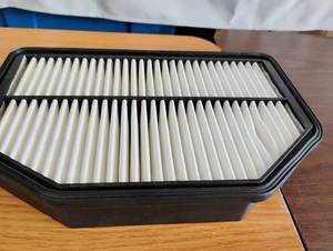 lot 1548 image: Engine Air Filter with Black Frame and Pleated White Media
