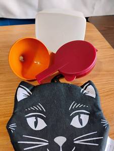 lot 1563 image: Tupperware tomatoes saver, funnel and storage container.  Cat Pot Holder
