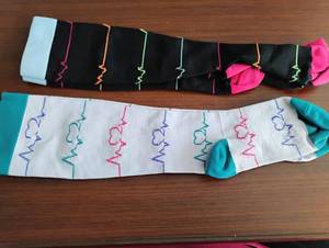 lot 1598 image: 2 Pairs Nursing Compression Socks with Heartbeat EKG Pattern Embroidery