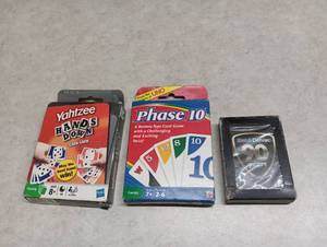 lot 14 image: 3-Piece Game and Collectible Lot Yahtzee Hands Down, Phase 10, Mobil Delvac 90 Years Poker Cards
