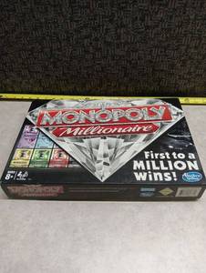 lot 18 image: Hasbro Monopoly Millionaire Board Game Ages 8 - incomplete Set