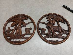 lot 64 image: SyrocoWood Carved Wall Plaques Pair Desert Scene Camel Palm Tree
