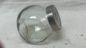 lot 62 image: Glass Storage Jar with Metal Lid and Perforated Insert