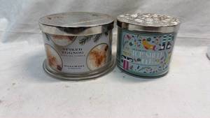 lot 386 image: Lot of 2 Scented Candles Homeworx Spiked Eggnog & Bath & Body Works Top Shelf Elf
