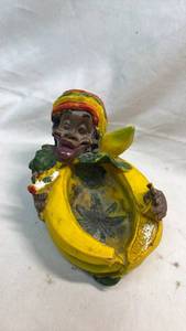 lot 393 image: Banana-shaped Ashtray with Human Head and Rasta Hat