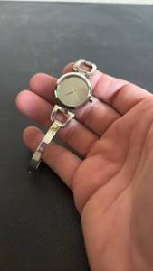 lot 1008 image: DKNY Womens Wristwatch with Bangle Bracelet and Mirror Finish Silver tone Face