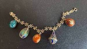 lot 1019 image: Vintage Sterling Silver Bracelet 4 Enamel Egg Russian Style Charms