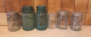 lot 1061 image: 6 Glass Canning Jars with Wire Bail Lids Mixed Sizes