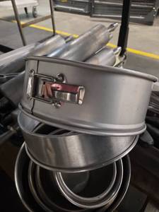 lot 1351 image: Springform Cake Pans, Mixing Bowls, Utensils, Dough Rollers, and Measuring Cups.