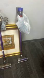 lot 10095 image: Dyson Cordless Stick Vacuum with Wall Dock and Floor Head - Retail $0