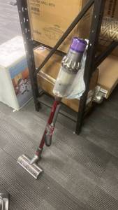 lot 10098 image: Dyson Cordless Hard Floor Cleaner with Liquid Tank Purple - Retail $0