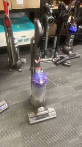 lot 10102 image: Dyson Upright Carpet Cleaner with Purple Tank and Accessories - Retail $0