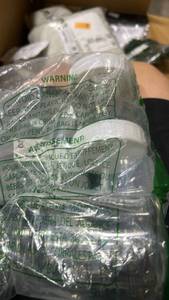 lot 136 image: Clear Plastic Bottles with White Caps in Poly Bag