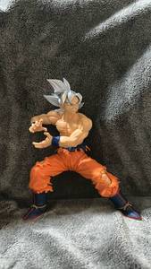 lot 281 image: Dragon Ball Super Goku Ultra Instinct Figure Silver Hair Orange Pants Combat Pose