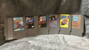 lot 285 image: 6PC Nintendo NES Game Themed Pressed Treated Coasters