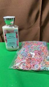 lot 546 image: Bath & Body Works Hello Beautiful Body Lotion and Colorful Hair Elastics Bundle - Retail $14