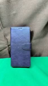 lot 602 image: iPhone 15 Pro Purple Wallet Phone Case with magnetic Hold to Wallet that Releases with a Tug. (Color on pictures is not true, it is most like the second picture