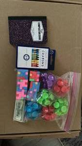 lot 625 image: Kids Activity Set with Mini Composition Book, Crayons, 6PC Multi Suction Ball Set and Eraser Puzzle Blocks and a $100 Bill Eraser. - Retail $13