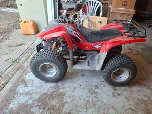 lot 1516A image: Red 4 Wheeler ATV