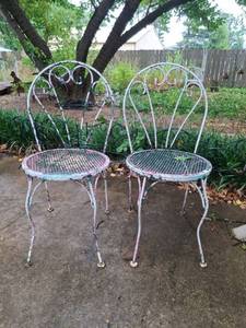 lot 1005 image: Pair of Metal Patio Chairs with Mesh Seats and Ornamental Backs