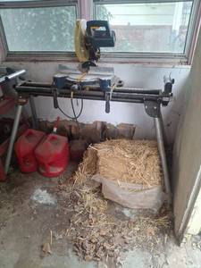 lot 1053 image: RYOBI 10 Compound Miter Saw and Stand