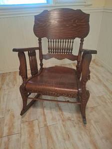 lot 1200 image: Antique Wooden Rocking Chair with Spindle Back and Carved Arms