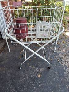 lot 1360 image: Metal Baby Crib and Rolling Basket with Decor