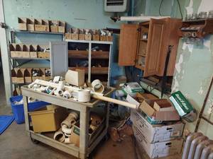lot 1217 image: Plumbing & Building Supplies Lot - PVC Fittings, stone veneer, carts and cabinets