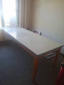 lot 1242 image: Work Table with White Top and Wood Base - Upstairs