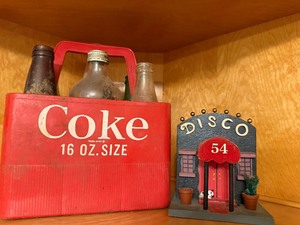 lot 514 image: Misc Vintage Bottles in Plastic Coke Holder, Coasters