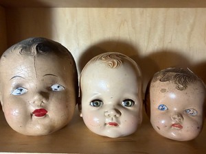 lot 145 image: Creepy Doll Heads, One Blinks