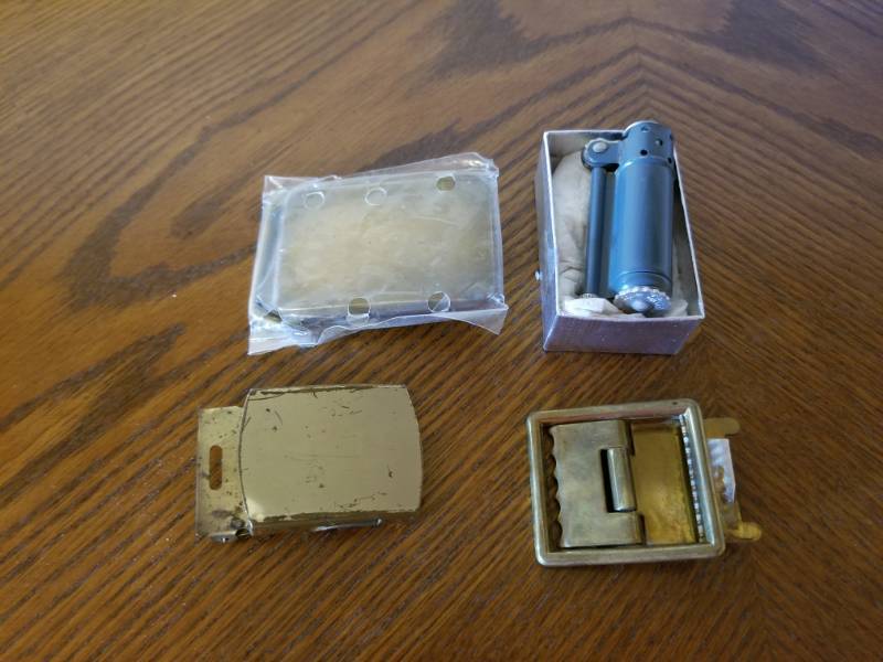 lot 3035 image: Brass Belt Buckles and Lighter Lot
