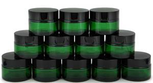 lot 8206 image: Vivaplex Green 1 oz Round Glass Jars with Inner Liners and black Lids - 12 pk