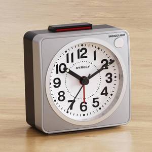 lot 8425 image: AYRELY� 2.6 � 1.4 Ultra Small Battery Operated Analog Travel Alarm Clock