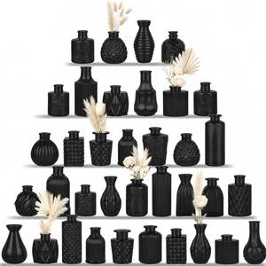 lot 11962 image: UPBUD Black Glass Bud Vases Set of 36, Mini Flower Vase for Centerpieces (Missing One)