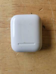 lot 20026 image: Apple AirPods 1st Gen with Charging Case (Wont Connect, Sold As Is, Minor Cosmetic Damage on Case)