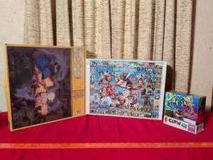 lot 343 image: Lot of 3 Puzzles Spellbound, Great American Authors, Glow in the Dark Tiger